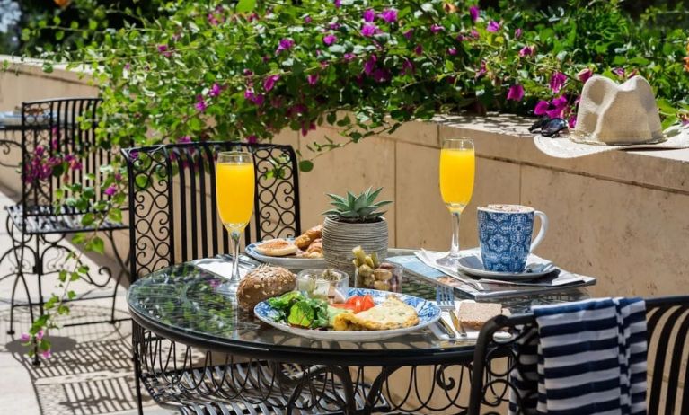 Breakfast available on outdoor terrace at Prima Royale Hotel.