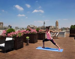 Yoga on the roof at Prima Royale Hotel.