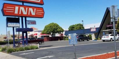 Hotel exterior at Economy Inn, Fresno.