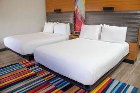 Day use room with two beds at Aloft Miami Doral.
