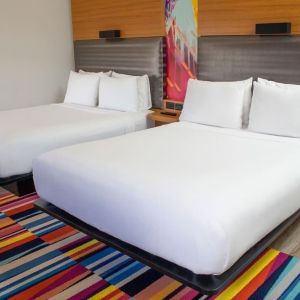 Day use room with two beds at Aloft Miami Doral.
