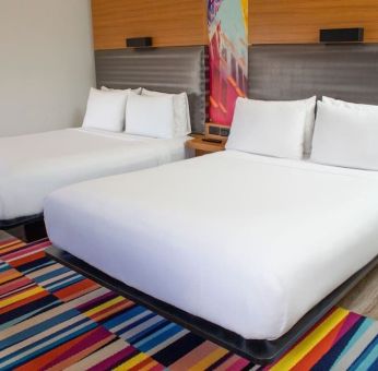 Day use room with two beds at Aloft Miami Doral.
