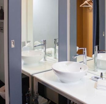 Guest bathroom with shower at Aloft Miami Doral.
