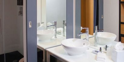 Guest bathroom with shower at Aloft Miami Doral.
