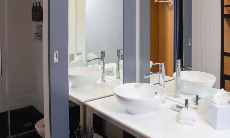 Guest bathroom with shower at Aloft Miami Doral.
