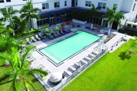 Outdoor pool area at Aloft Miami Doral.
