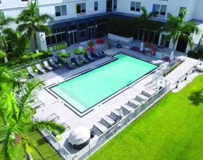 Outdoor pool area at Aloft Miami Doral.
