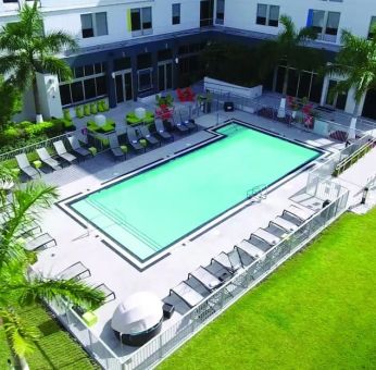 Outdoor pool area at Aloft Miami Doral.
