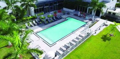 Outdoor pool area at Aloft Miami Doral.
