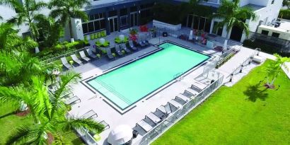 Outdoor pool area at Aloft Miami Doral.
