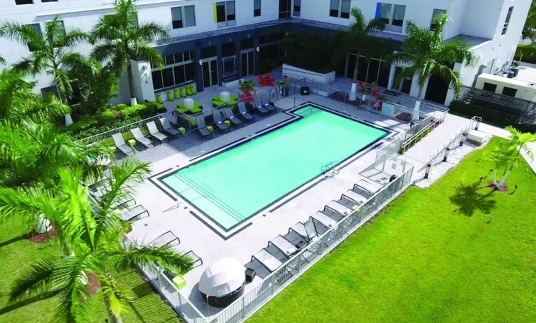 Outdoor pool area at Aloft Miami Doral.
