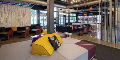 lobby and seating area at Aloft Miami Doral.
