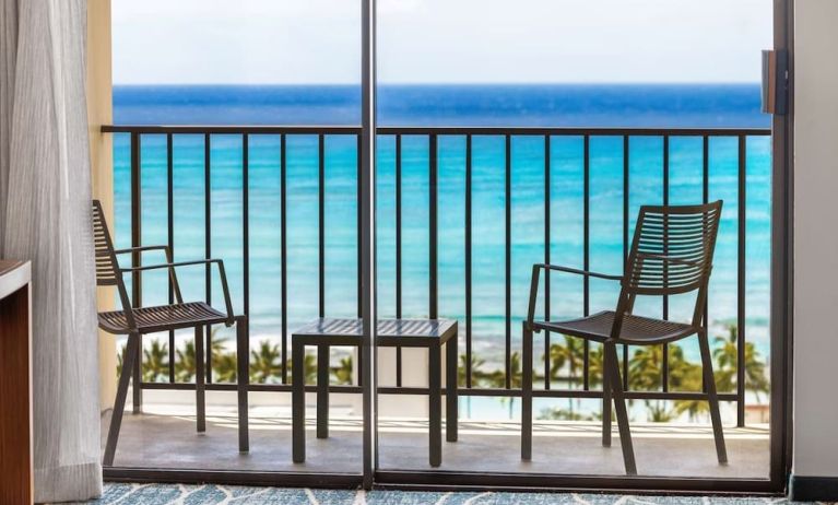 Day room with balcony and sea view at Hyatt Place Waikiki Beach.