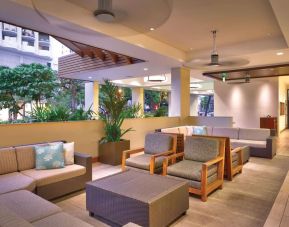 Lounge and coworking space at Hyatt Place Waikiki Beach.