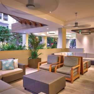 Lounge and coworking space at Hyatt Place Waikiki Beach.