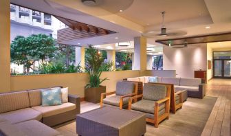 Lounge and coworking space at Hyatt Place Waikiki Beach.