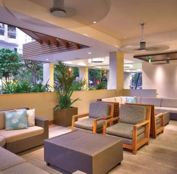 Lounge and coworking space at Hyatt Place Waikiki Beach.