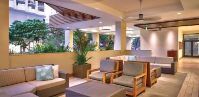 Lounge and coworking space at Hyatt Place Waikiki Beach.