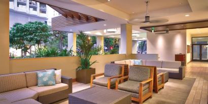 Lounge and coworking space at Hyatt Place Waikiki Beach.