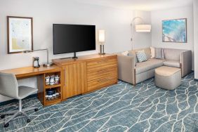 Day room with TV and work space at Hyatt Place Waikiki Beach.