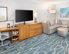 Day room with TV and work space at Hyatt Place Waikiki Beach.