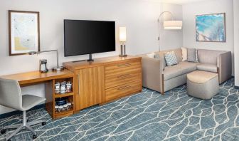 Day room with TV and work space at Hyatt Place Waikiki Beach.