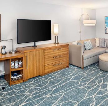 Day room with TV and work space at Hyatt Place Waikiki Beach.