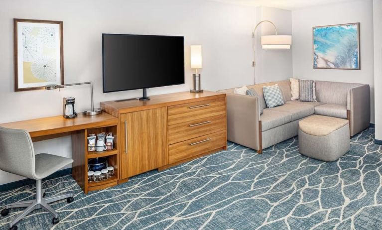 Day room with TV and work space at Hyatt Place Waikiki Beach.