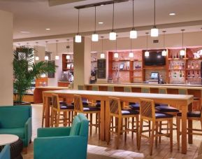 Hotel bar and coworking area at Hyatt Place Waikiki Beach.