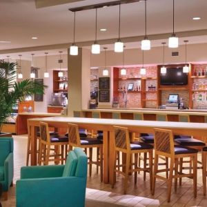 Hotel bar and coworking area at Hyatt Place Waikiki Beach.