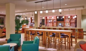 Hotel bar and coworking area at Hyatt Place Waikiki Beach.