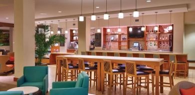 Hotel bar and coworking area at Hyatt Place Waikiki Beach.