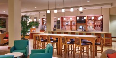 Hotel bar and coworking area at Hyatt Place Waikiki Beach.