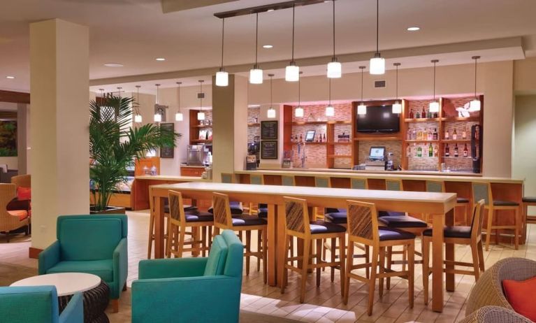 Hotel bar and coworking area at Hyatt Place Waikiki Beach.