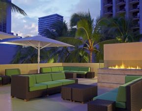 Rooftop terrace and fire pit at Hyatt Place Waikiki Beach.