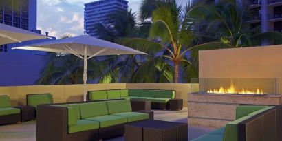 Rooftop terrace and fire pit at Hyatt Place Waikiki Beach.