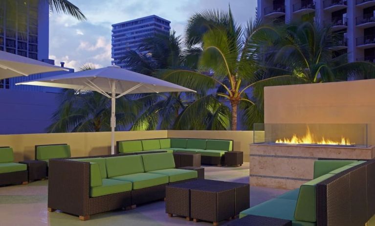 Rooftop terrace and fire pit at Hyatt Place Waikiki Beach.