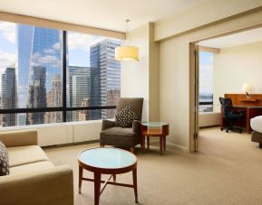 Luxurious king suite with lounge area at Millennium Downtown New York.