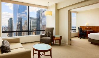 Luxurious king suite with lounge area at Millennium Downtown New York.