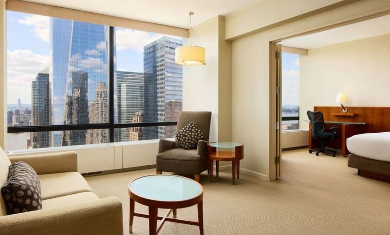 Luxurious king suite with lounge area at Millennium Downtown New York.