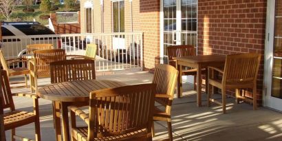 Outdoor seating and terrace at Country Inn & Suites By Radisson, BWI Airport.