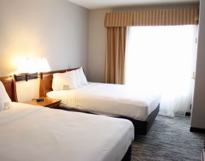 Spacious day room with two queen beds at Country Inn & Suites By Radisson, BWI Airport.