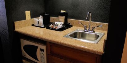 King room with kitchen area at Country Inn & Suites By Radisson, BWI Airport.