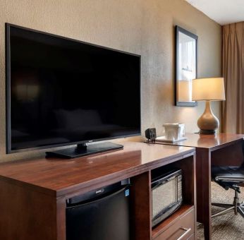 Day room with TV and work station at Comfort Suites Baymeadows Near Butler Blvd.