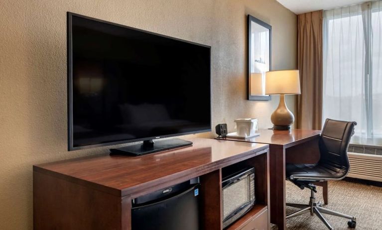 Day room with TV and work station at Comfort Suites Baymeadows Near Butler Blvd.