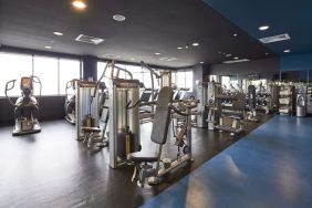 Fitness center at Rydges Sydney Airport Hotel.