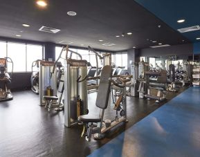 Fitness center at Rydges Sydney Airport Hotel.