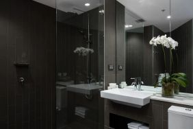 Guest bathroom with shower at Rydges Sydney Airport Hotel.