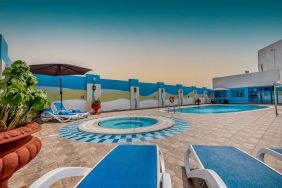 Outdoor pool with loungers at The Park Hotel.