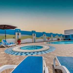 Outdoor pool with loungers at The Park Hotel.